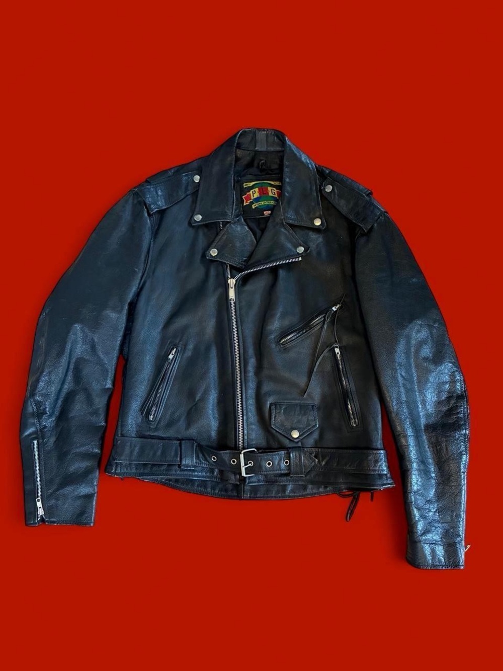 Vintage 80s/90s Black world wide Putnam leather gold biker jacket
